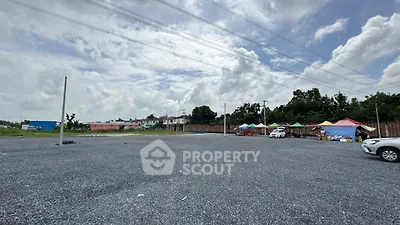 Spacious open land with potential for development under a clear sky.