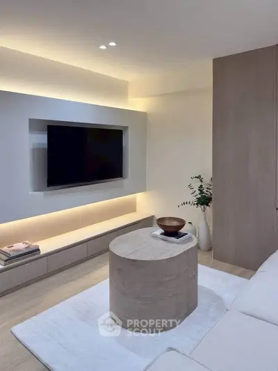 Modern living room with sleek TV setup and minimalist decor