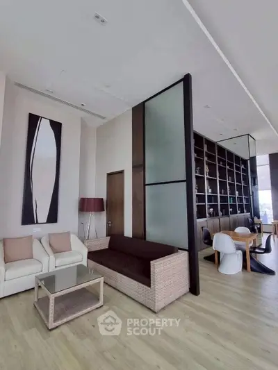 Modern living room with stylish decor and open dining area