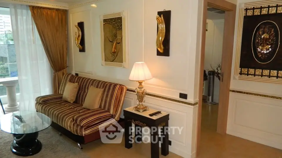 Luxurious living room with elegant decor and large window offering natural light.