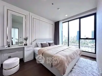 Luxurious bedroom with stunning city view and elegant decor