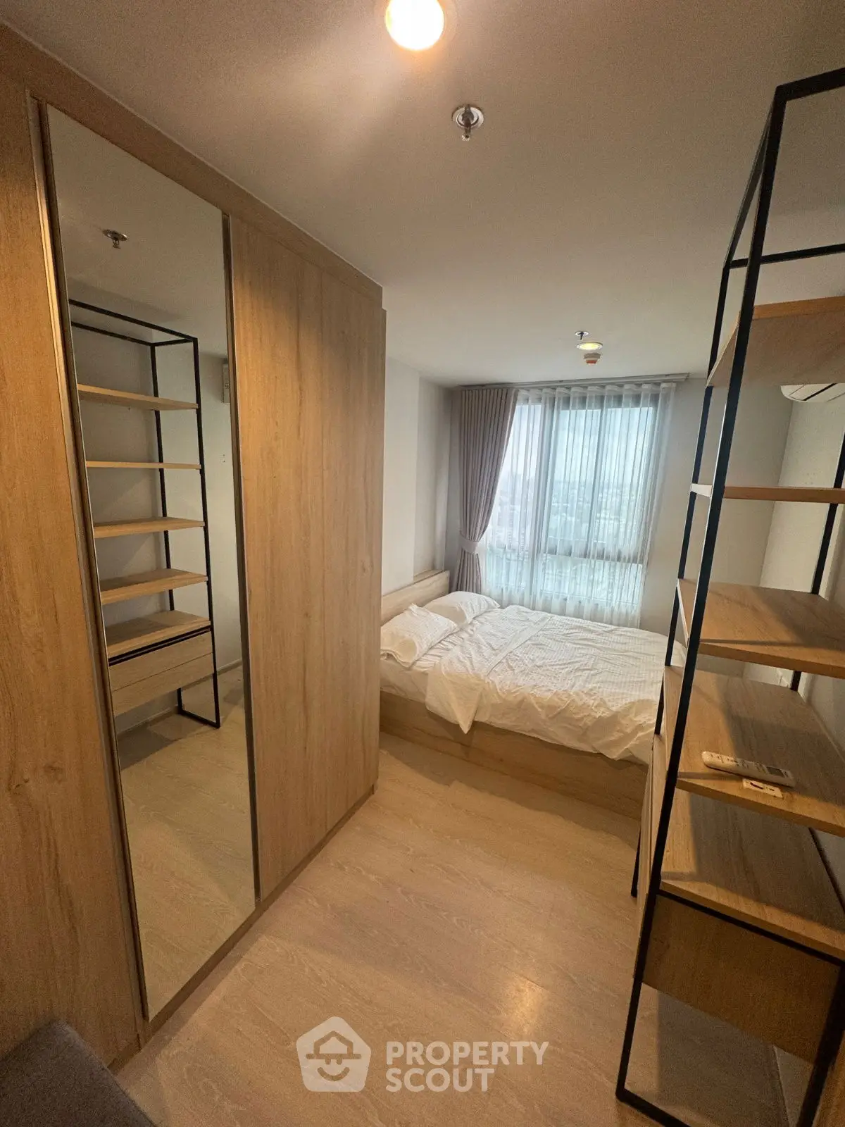 Cozy bedroom with modern wooden furniture and natural light