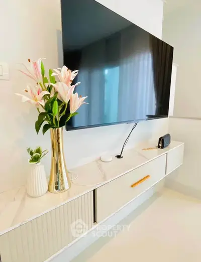 Modern living room with wall-mounted TV and elegant decor