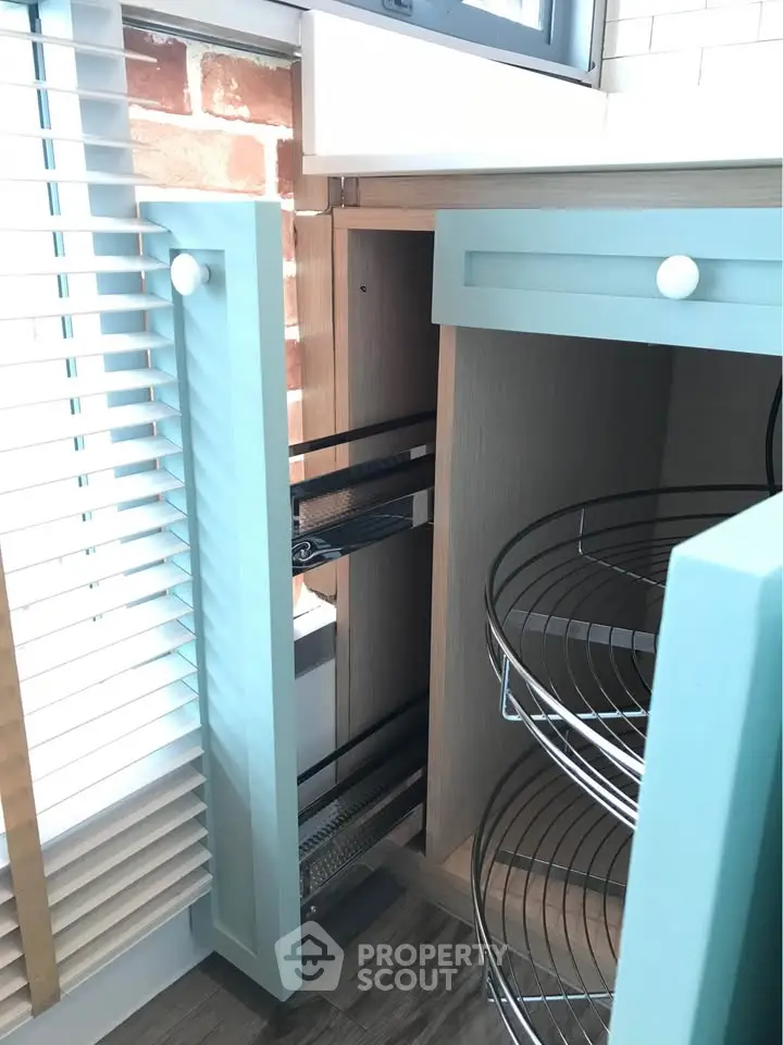 Modern kitchen cabinet with innovative corner storage solution and sleek design.