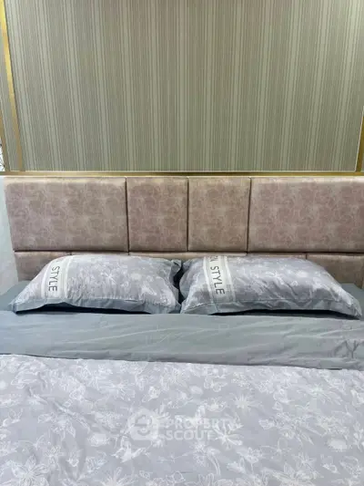 Luxurious bedroom with stylish headboard and elegant bedding