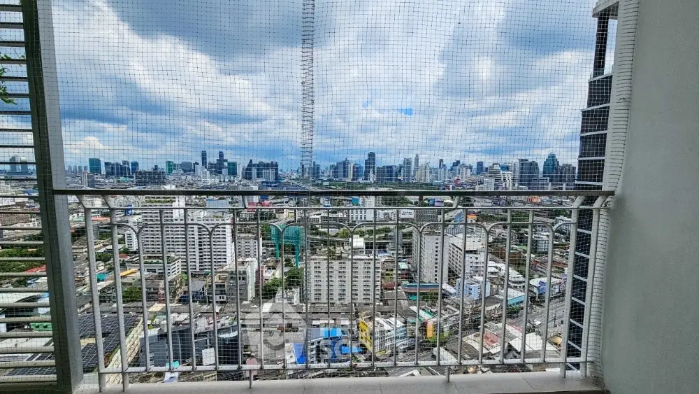Stunning cityscape view from high-rise balcony with modern railing