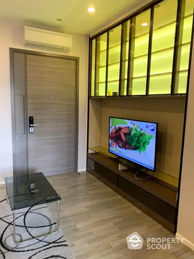 Modern living room with stylish TV unit and glass cabinet