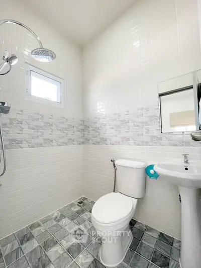 Modern bathroom with sleek tiles and contemporary fixtures