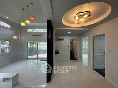 Spacious modern living room with high ceilings and stylish lighting