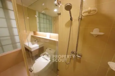 Modern bathroom with glass shower and sleek fixtures