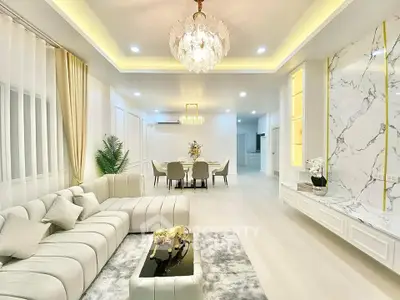 Luxurious living room with elegant chandelier and modern decor