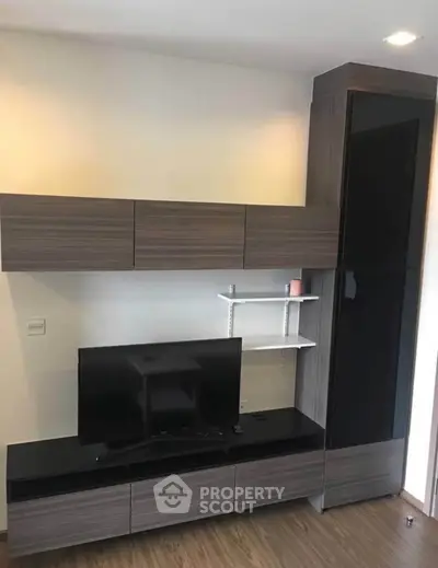 Modern living room with sleek TV unit and stylish storage cabinets