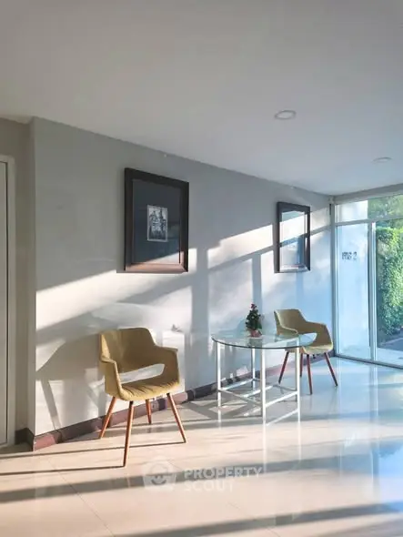 Bright and modern entrance with stylish seating and natural light