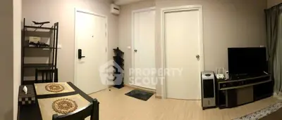 Cozy living room with modern decor and entertainment setup, perfect for relaxation and leisure.