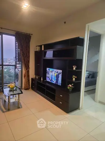 Modern living room with city view and stylish entertainment center