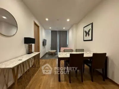 Modern living room with elegant dining area and stylish decor