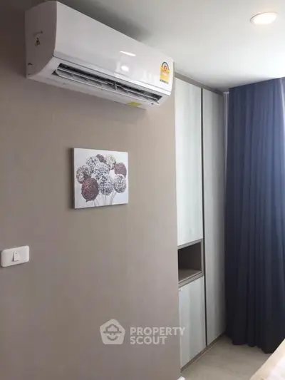 Modern bedroom with air conditioning and stylish decor