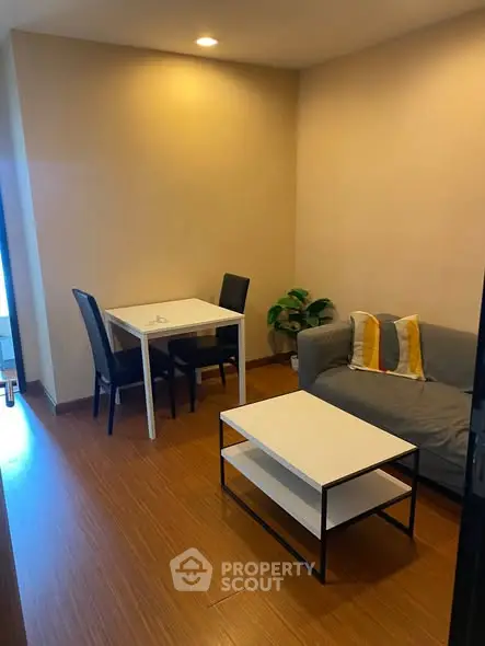 Cozy living room with modern furniture and warm lighting, perfect for relaxation and entertaining.