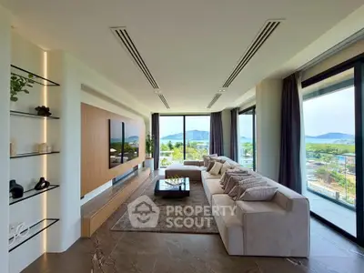 Luxurious living room with panoramic views and modern decor in a high-end property.