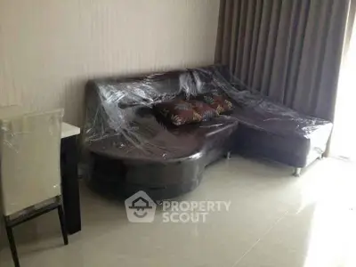 Modern living room with sleek leather sofa and elegant decor