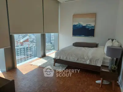 Luxurious bedroom with stunning city view and modern decor