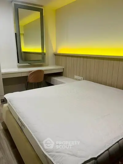 Modern bedroom with ambient lighting and stylish furniture