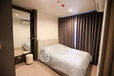 Cozy bedroom with modern decor and ample natural light