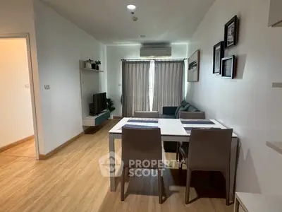 Modern living room with dining area and natural light