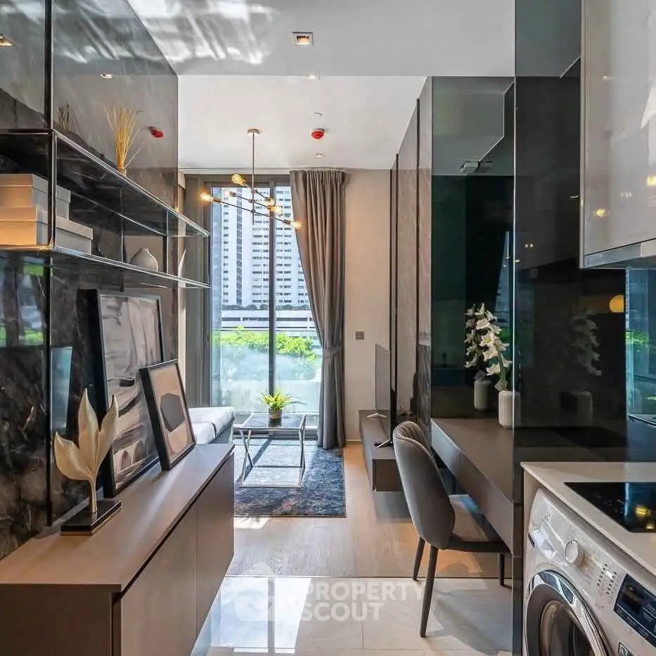 Modern apartment interior with stylish decor and city view, featuring a washing machine and elegant furnishings.