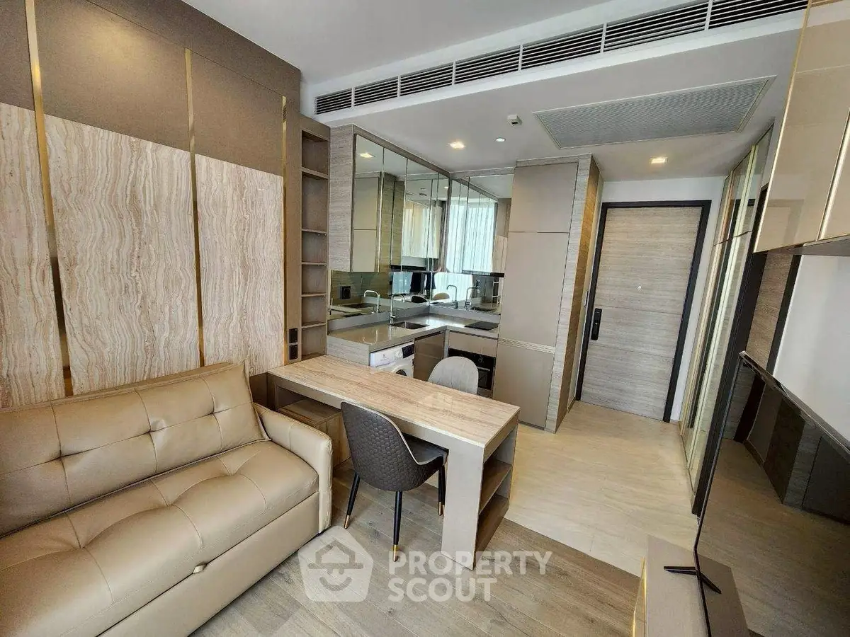 Modern living room with open kitchen and stylish decor