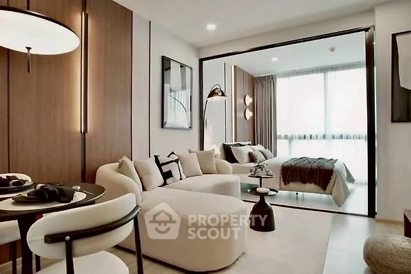 Modern open-plan living room with stylish decor and natural light
