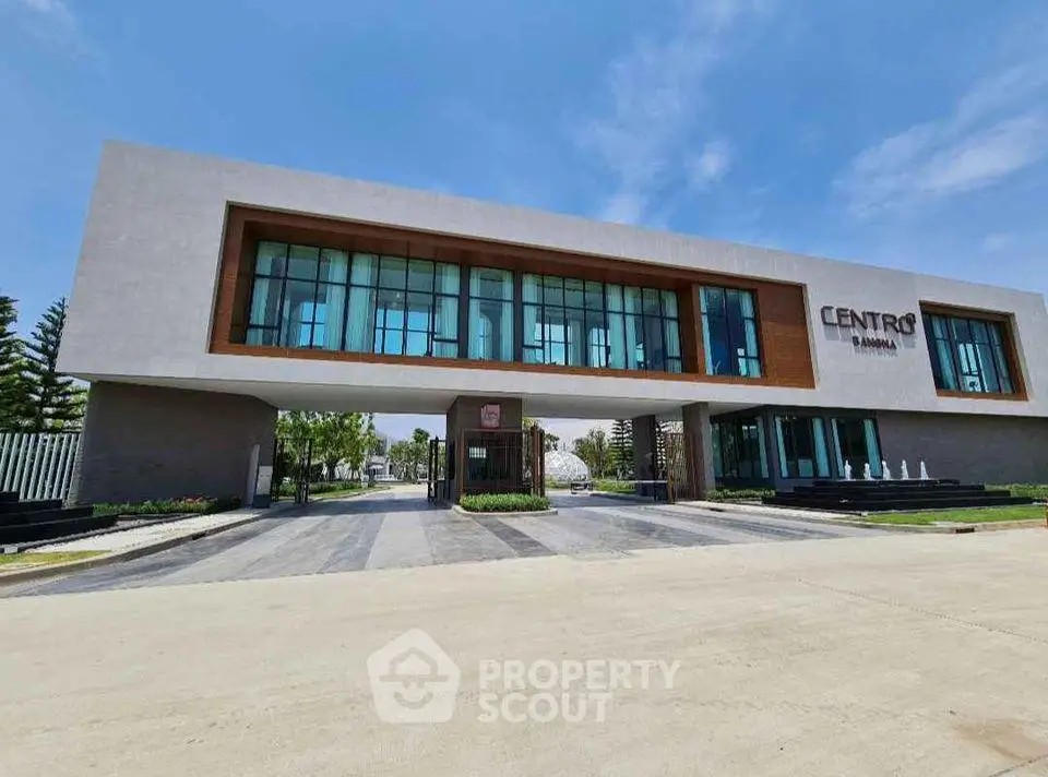 Modern commercial building with large glass windows and sleek design