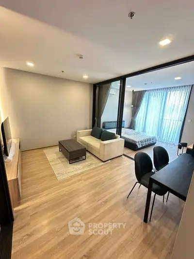 Modern open-plan living room with stylish furniture and natural light