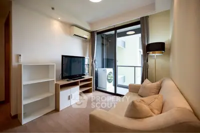 Modern living room with balcony and washing machine view