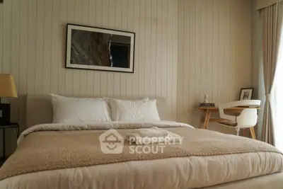 Cozy bedroom with elegant decor and natural light, featuring a comfortable bed and stylish furnishings.