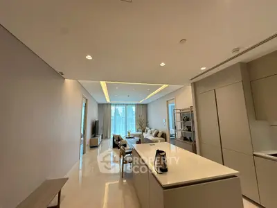 Luxurious open-plan living room with modern kitchen and elegant decor