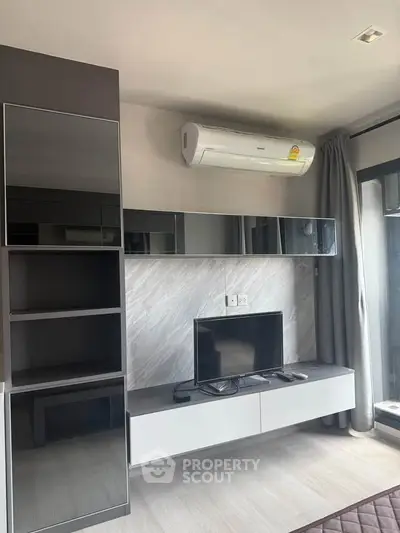 Modern living room with sleek built-in storage and air conditioning