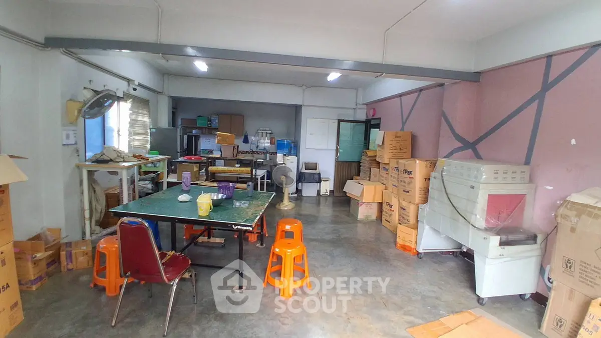 Spacious storage room with ample shelving and natural light, ideal for organizing and storing items efficiently.