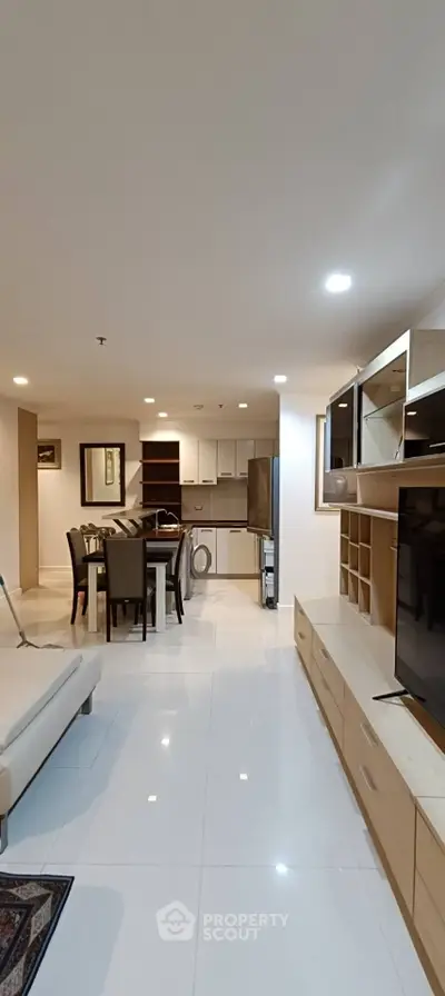 Spacious open-plan living room with modern kitchen and dining area