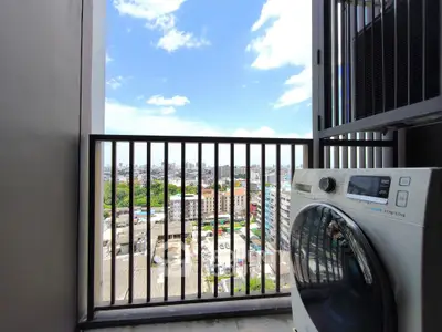 Stunning city view from a modern balcony with washing machine