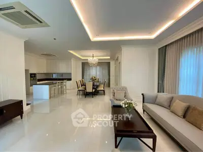 Luxurious open-plan living room with elegant dining area and modern kitchen