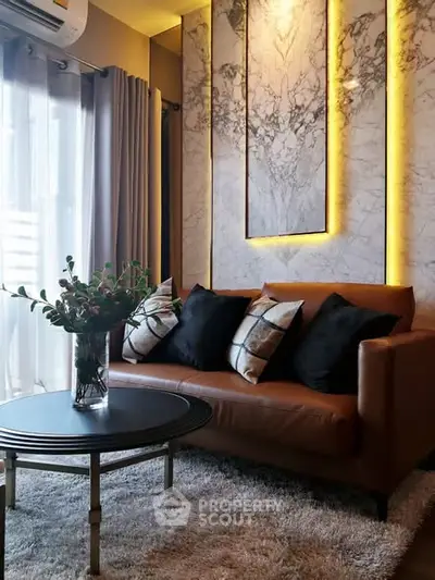 Luxurious living room with marble accent wall and cozy leather sofa