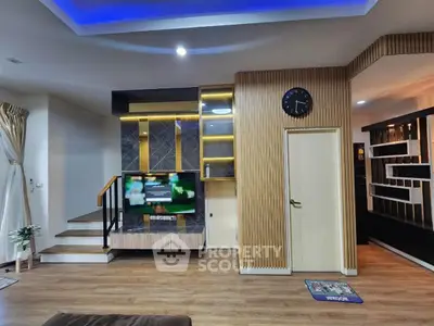 Modern living room with stylish decor and ambient lighting