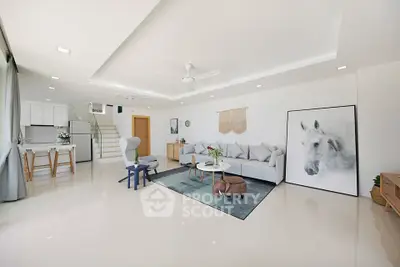 Spacious modern living room with elegant decor and open kitchen layout