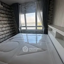 Modern bedroom with large window and stylish decor