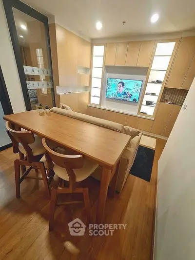 Modern living room with wooden furniture and built-in TV unit