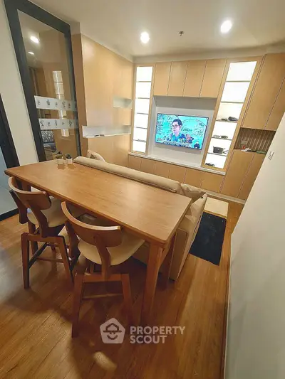 Modern living room with wooden furniture and built-in TV unit