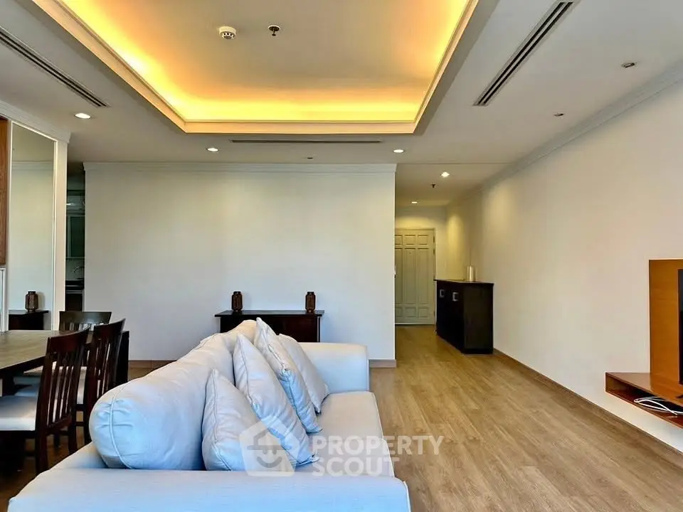 Spacious modern living room with elegant lighting and wooden flooring