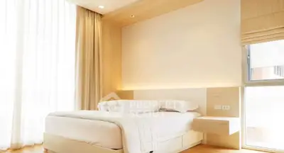 Bright and modern bedroom with natural light and minimalist design.