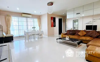 Spacious modern living room with elegant dining area and stylish decor.